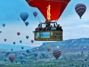 Group of passengers enjoying a peaceful hot air balloon ride