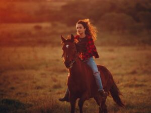 Tourist on safari horseback riding
