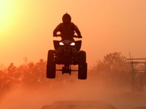 Quad bike speeding across Namibia’s vast desert landscape.
